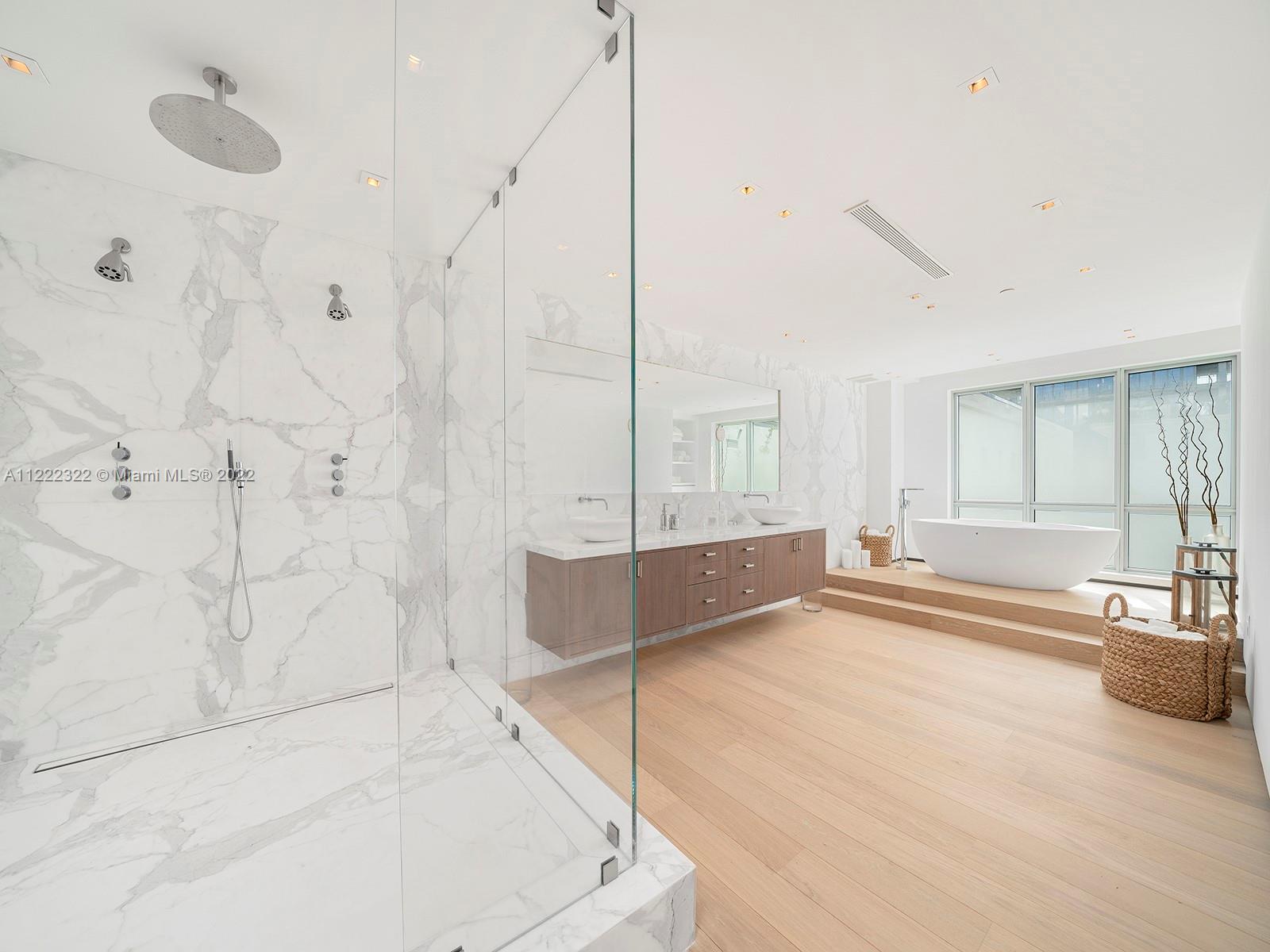 125 Ocean Drive, Unit U0301 Miami Beach, FL 33139 - Photo 5 of 15 a spacious bathroom with a tub and shower