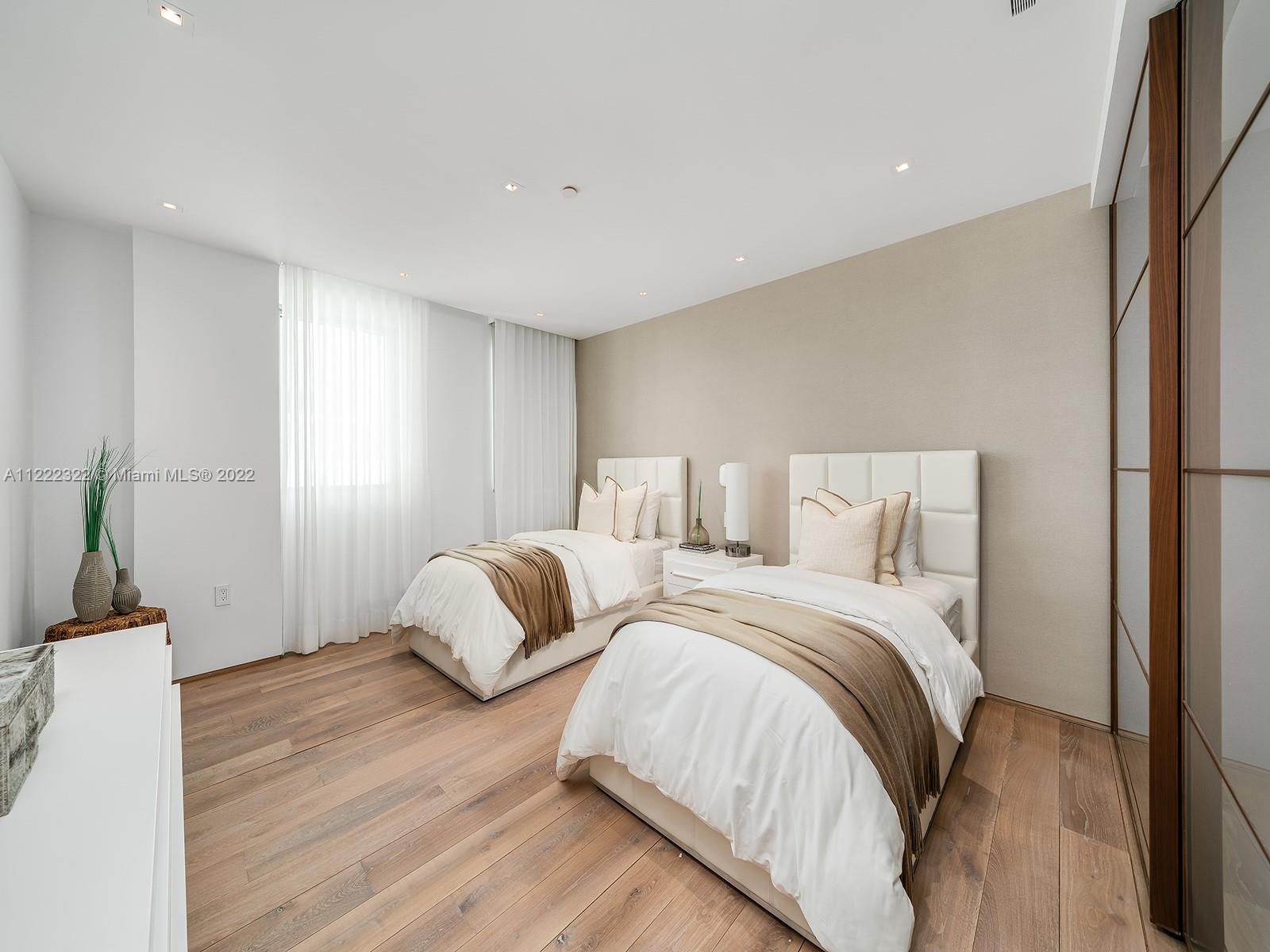 125 Ocean Drive, Unit U0301 Miami Beach, FL 33139 - Photo 8 of 15 a bedroom with two beds and painted walls