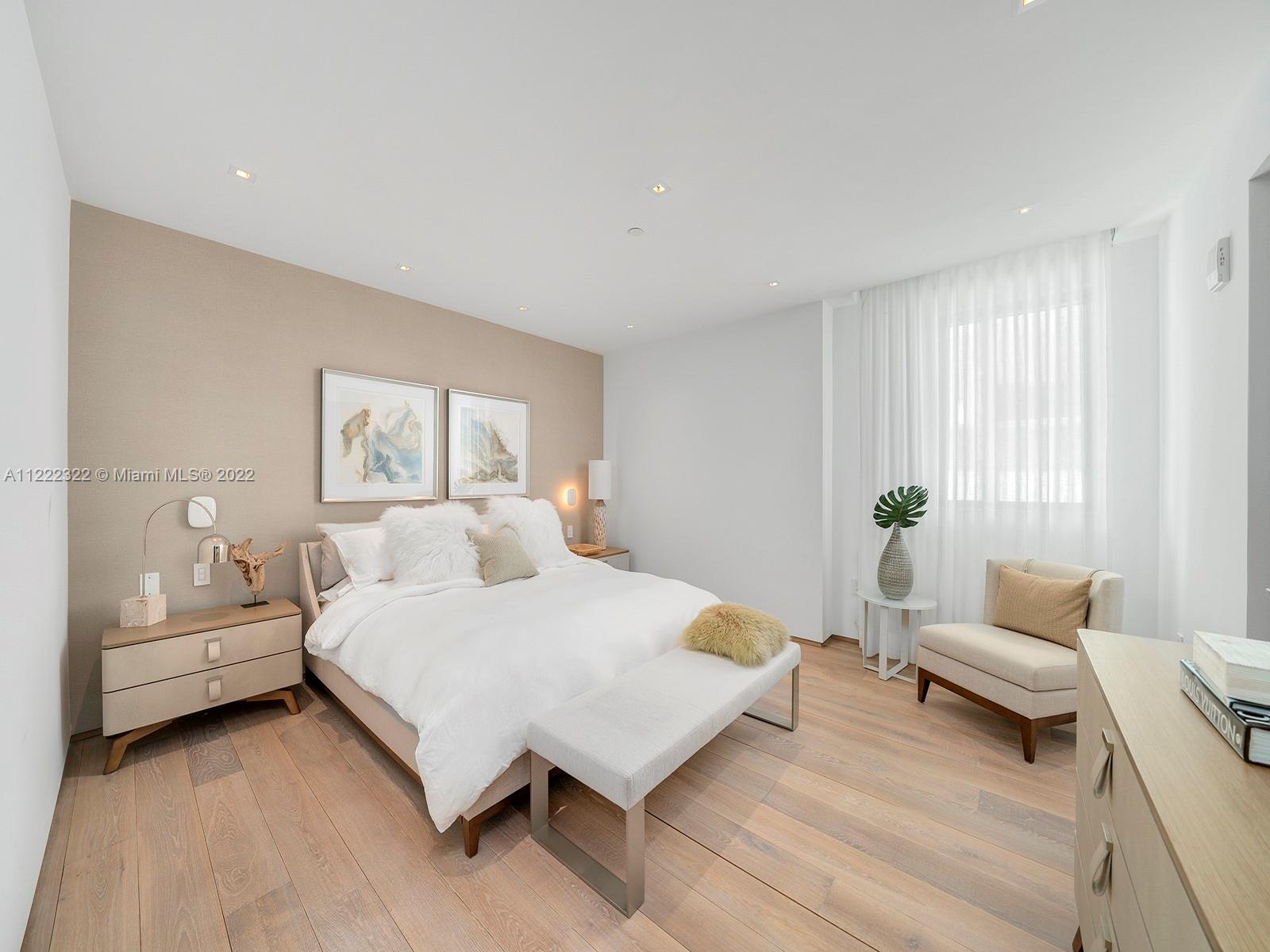 125 Ocean Drive, Unit U0301 Miami Beach, FL 33139 - Photo 9 of 15 a bedroom with a bed and a couch