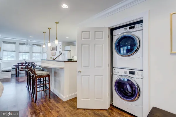 a view of a kitchen with washer and dryer