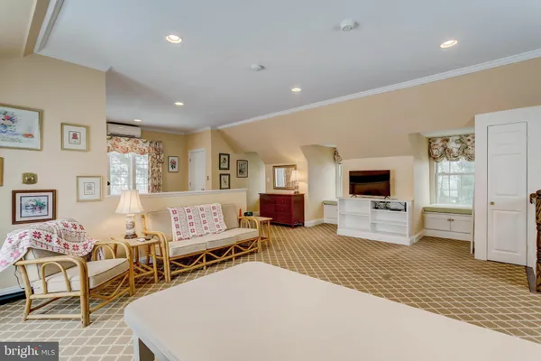 a bedroom with furniture and a wooden floor