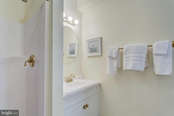 a bathroom with a sink and mirror