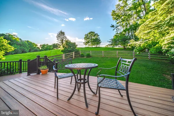 a view of a table and chairs on the roof deck