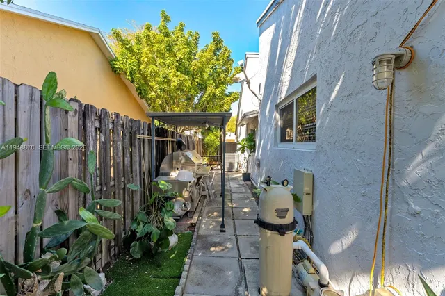 a view of a porch with potted plants