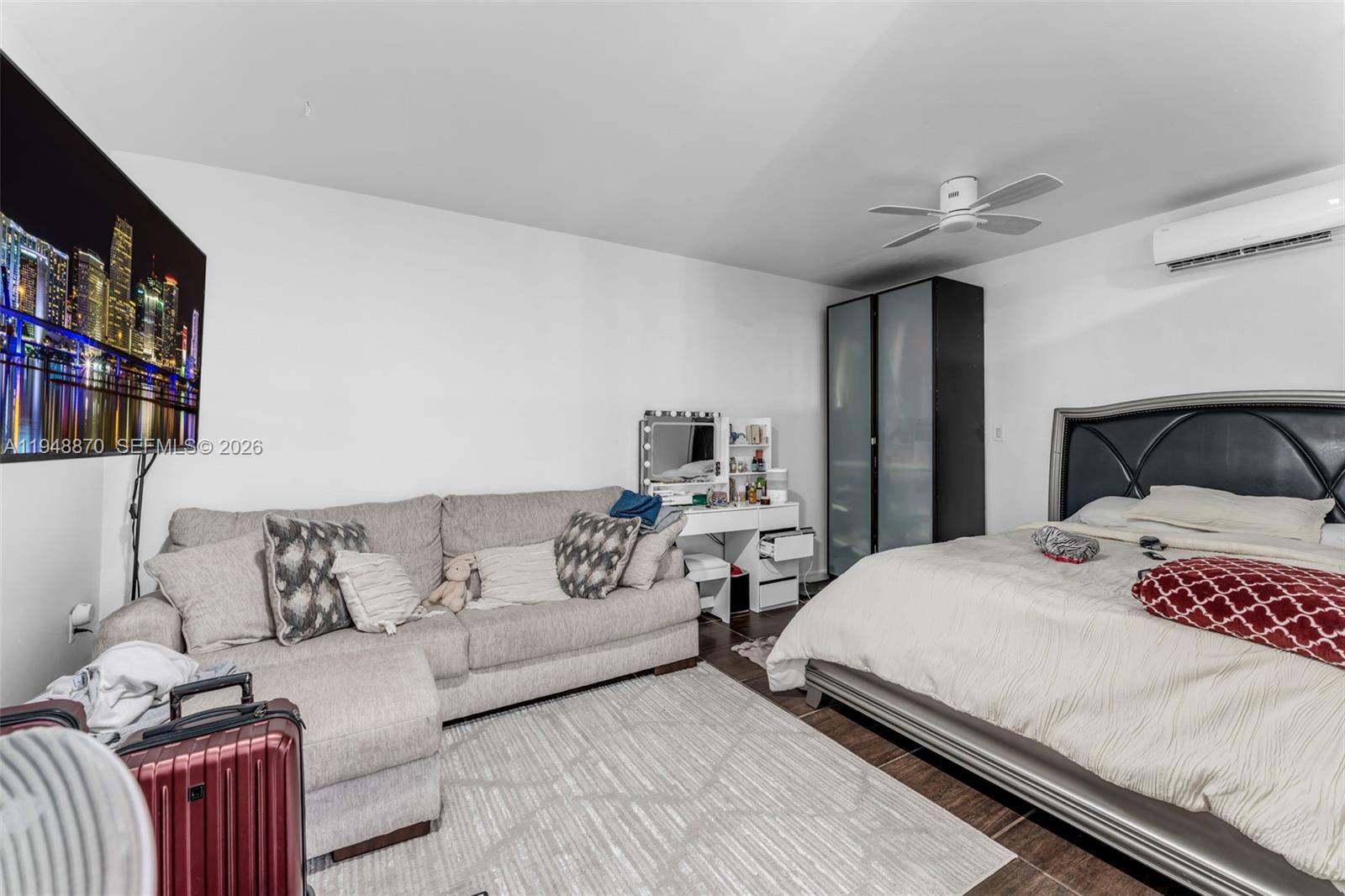 12210 Southwest 92nd Street Miami, FL 33186 - Photo 24 of 38 a bedroom with a bed and a couch