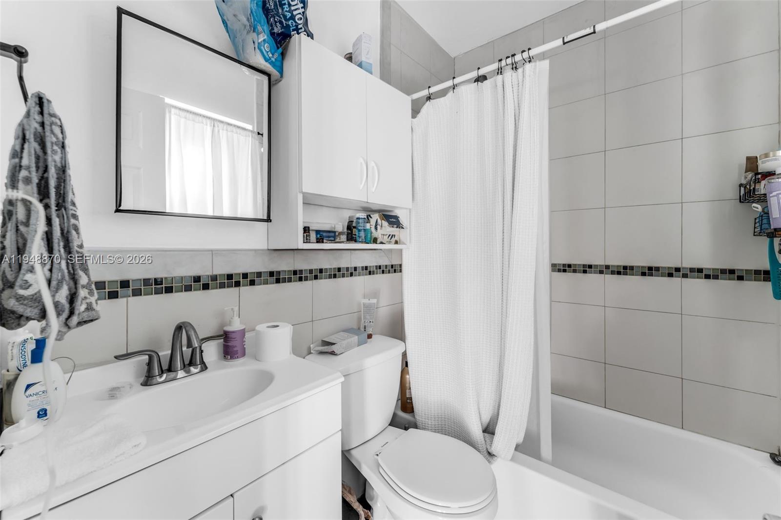 12210 Southwest 92nd Street Miami, FL 33186 - Photo 25 of 38 a bathroom with a sink a toilet and shower