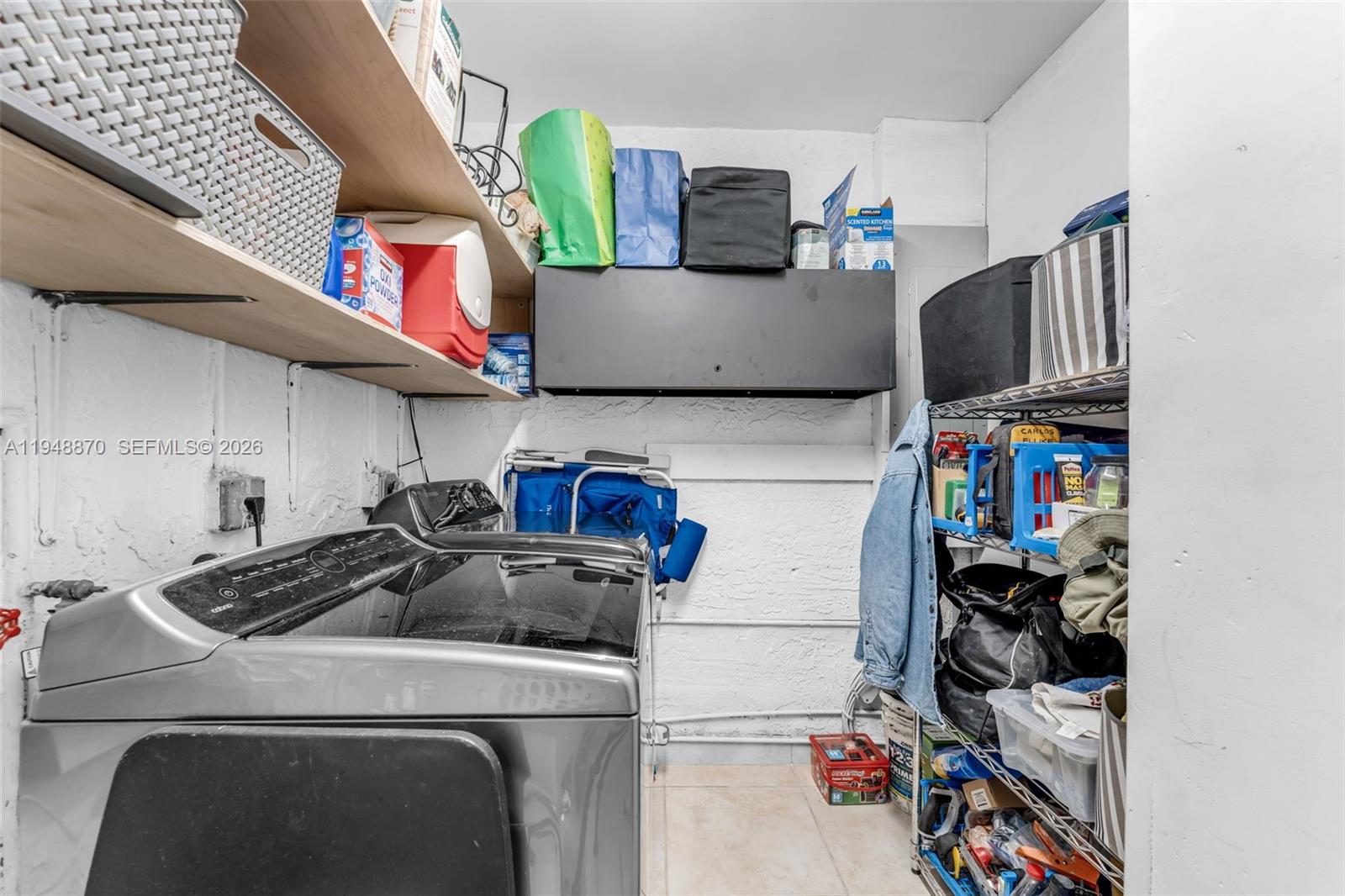 12210 Southwest 92nd Street Miami, FL 33186 - Photo 26 of 38 a view of storage and utility room with washer and dryer