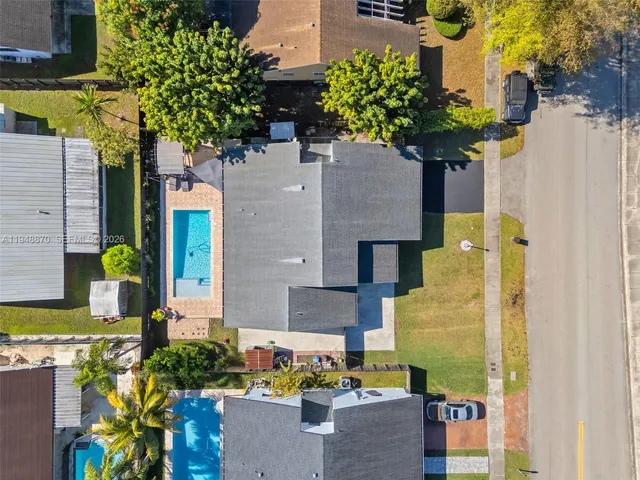 an aerial view of residential houses with outdoor space