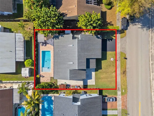 an aerial view of residential houses with outdoor space