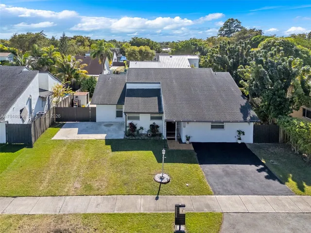 a view of a swimming pool with seating space
