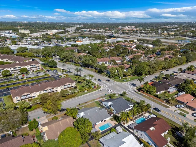 an aerial view of residential houses with outdoor space
