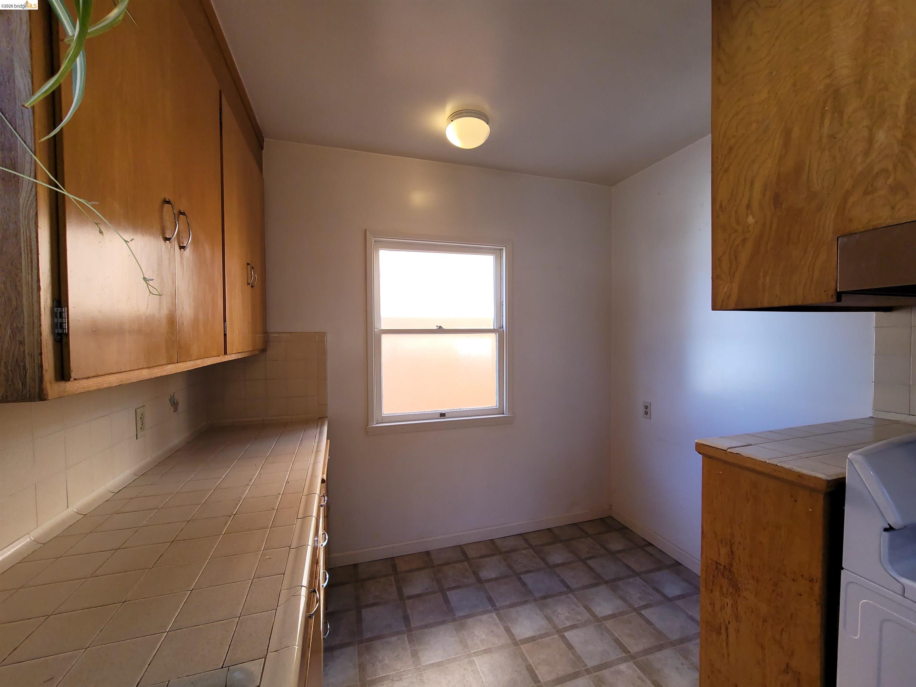 1901 Parker Street, Unit 3 Berkeley, CA 94704 - Photo 19 of 27 a view of an empty room with a window