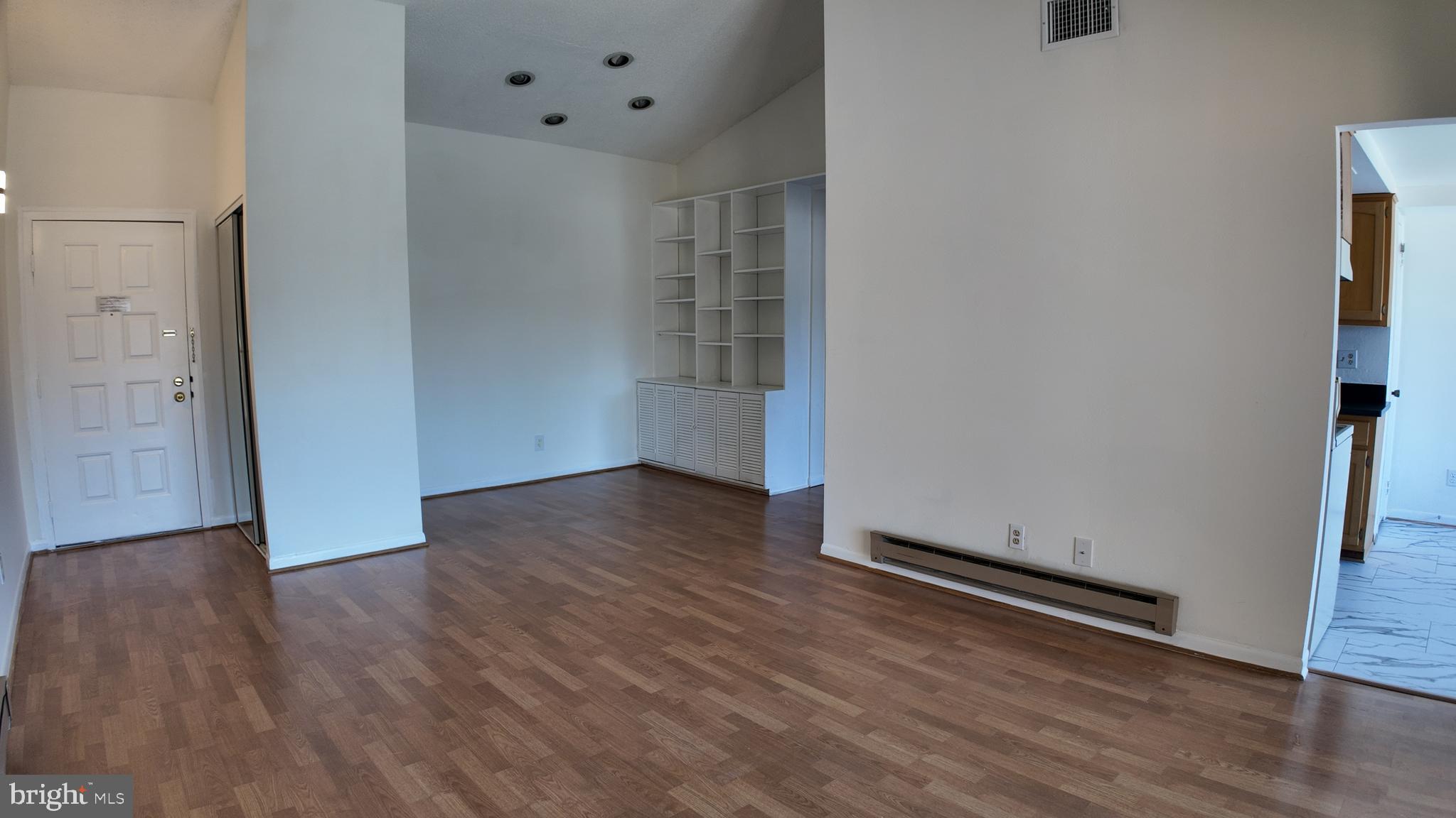 15311 Beaverbrook Court, Unit 903B Silver Spring, MD 20906 - Photo 10 of 36 an empty room with wooden floor