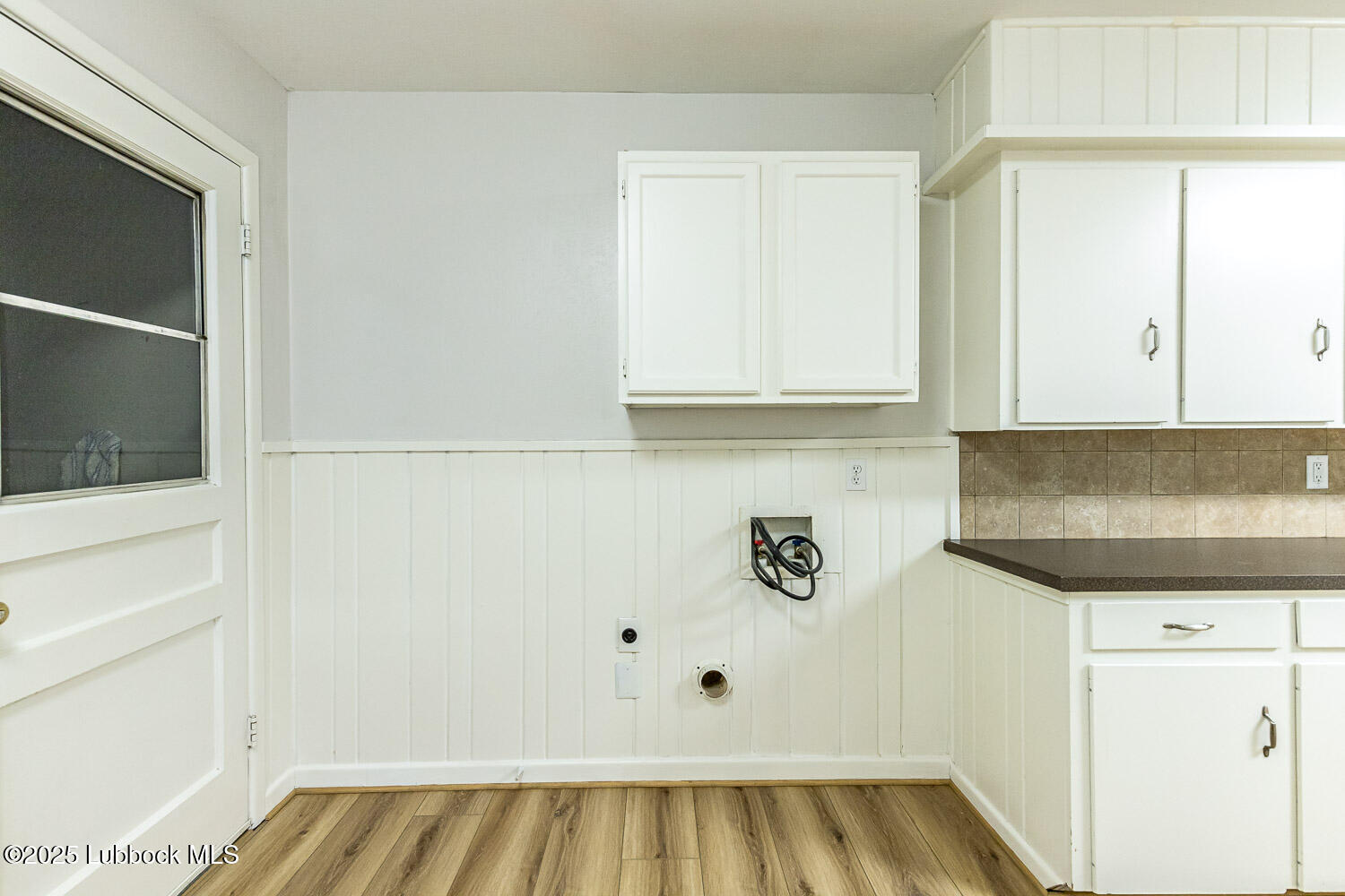 2601 33rd Street Lubbock, TX 79410 - Photo 15 of 30 a view of kitchen with microwave and cabinets