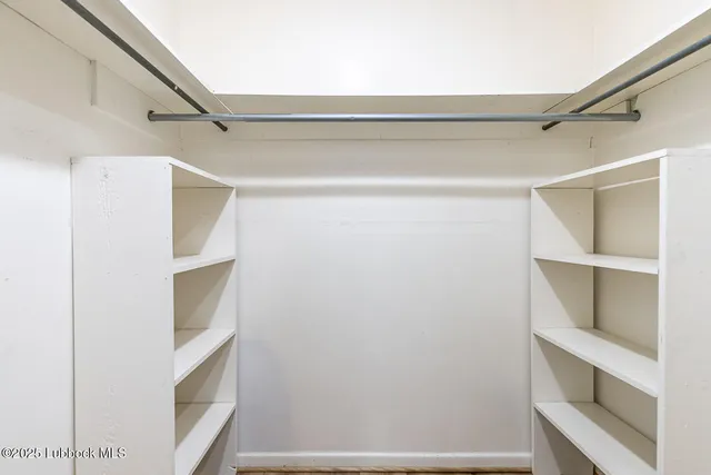 a view of an empty walk in closet
