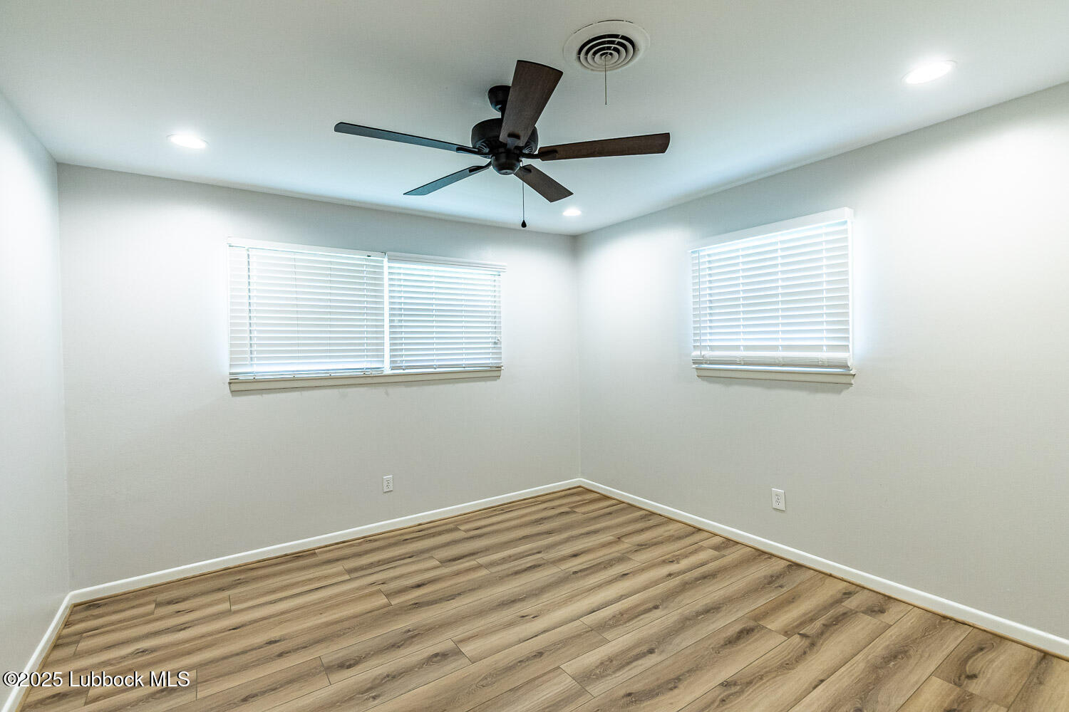 2601 33rd Street Lubbock, TX 79410 - Photo 22 of 30 a view of a room with a ceiling fan and a window