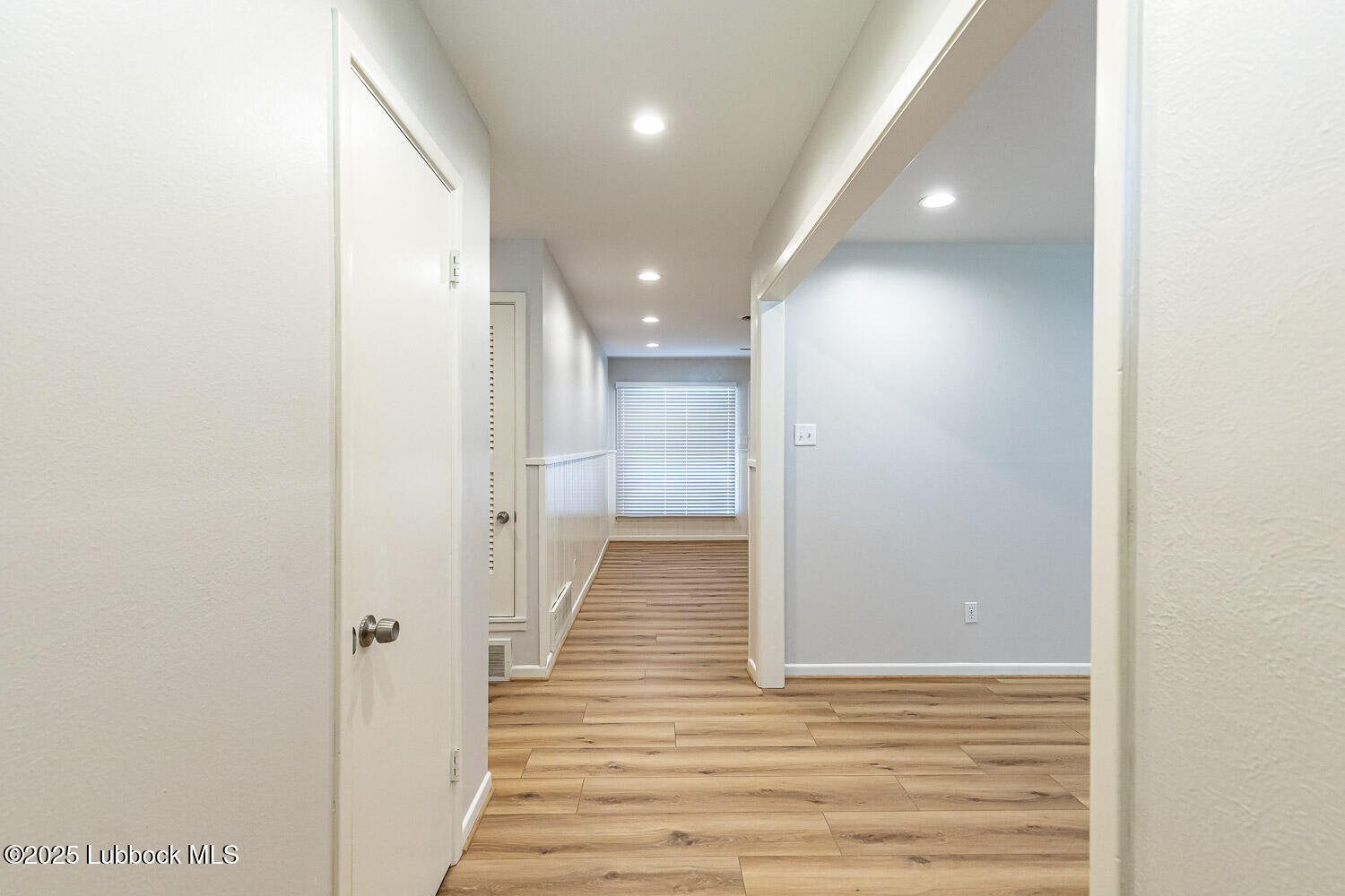 2601 33rd Street Lubbock, TX 79410 - Photo 3 of 30 a view of a hallway with wooden floor