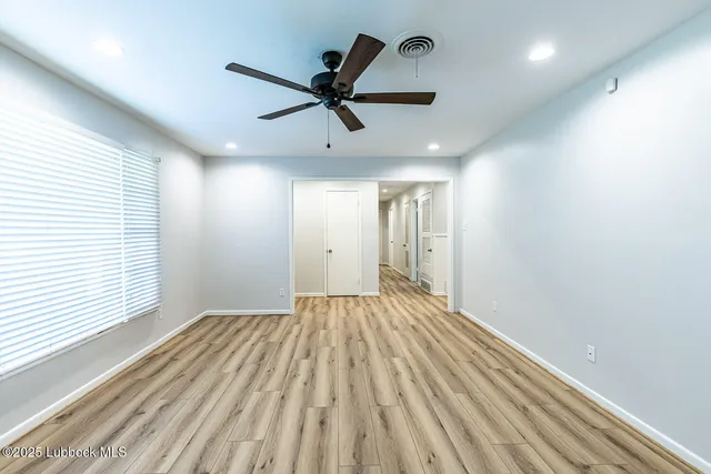 a view of an empty room and window