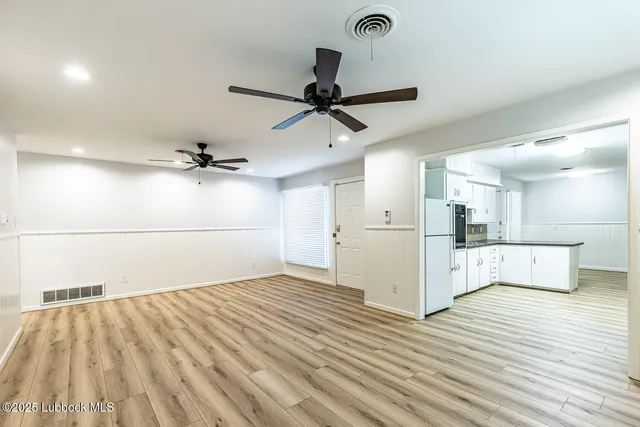 a view of a kitchen with wooden floor