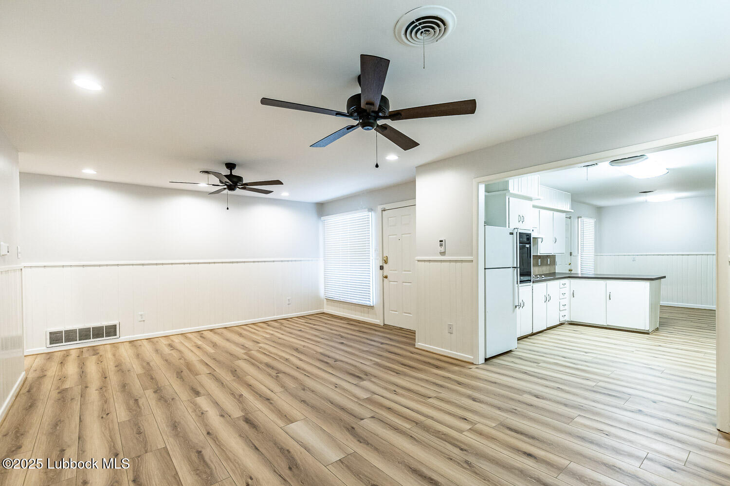 2601 33rd Street Lubbock, TX 79410 - Photo 9 of 30 a view of a kitchen with wooden floor