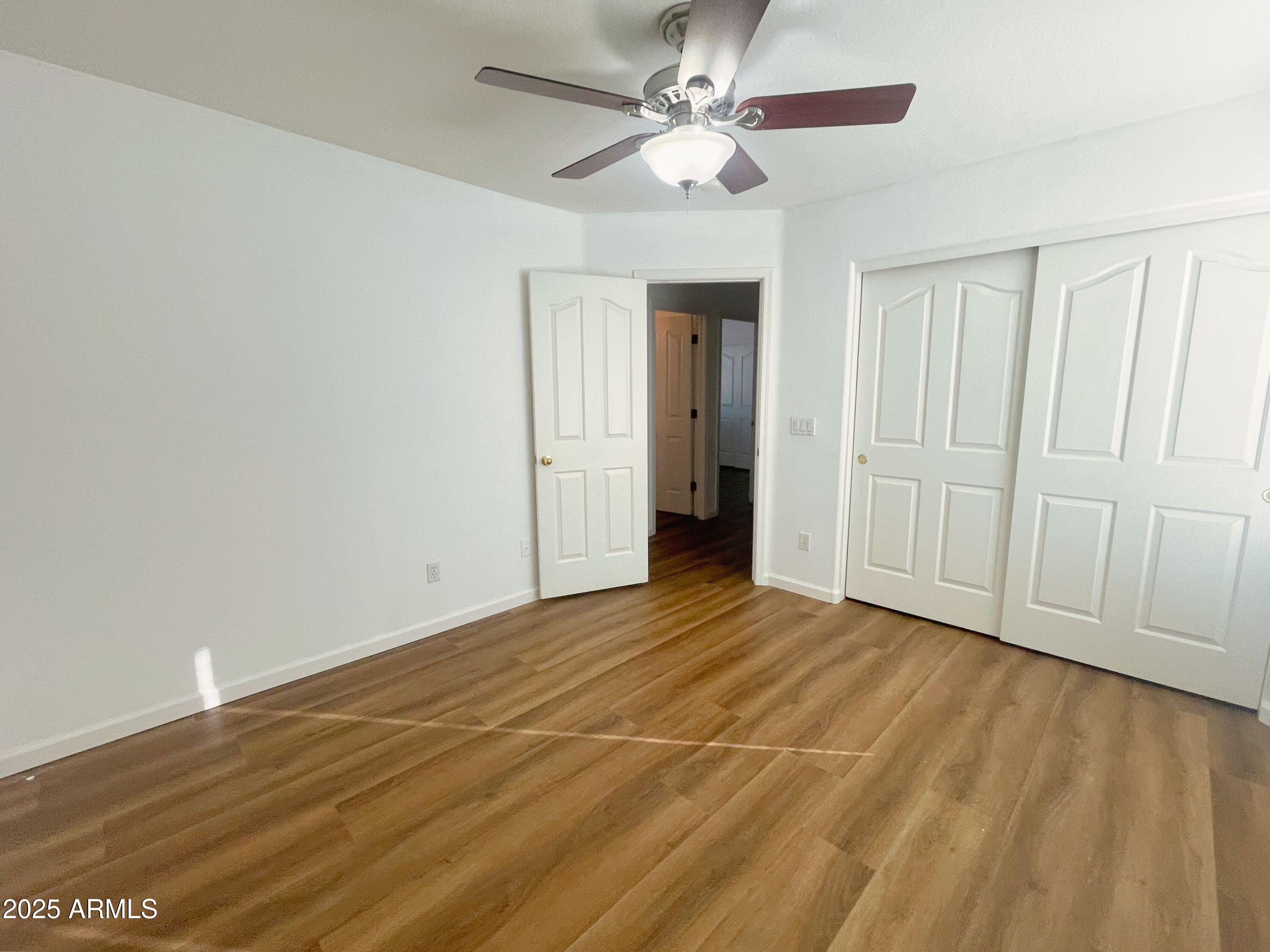 2211 South Harper Mesa, AZ 85209 - Photo 22 of 27 a view of empty room with wooden floor