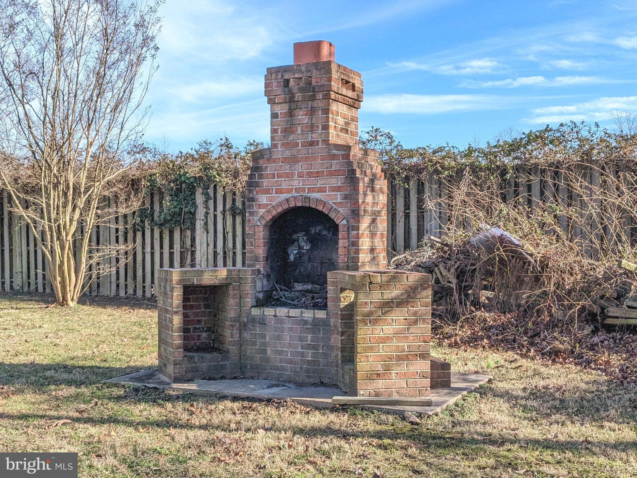 302 Biddle Road Accokeek, MD 20607 - Photo 16 of 43 Exterior Brick BBQ Pit