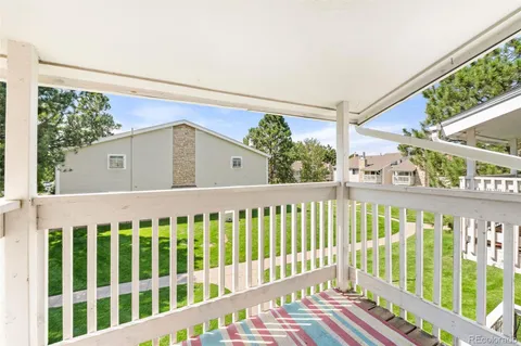 a view of a small house and wooden roof