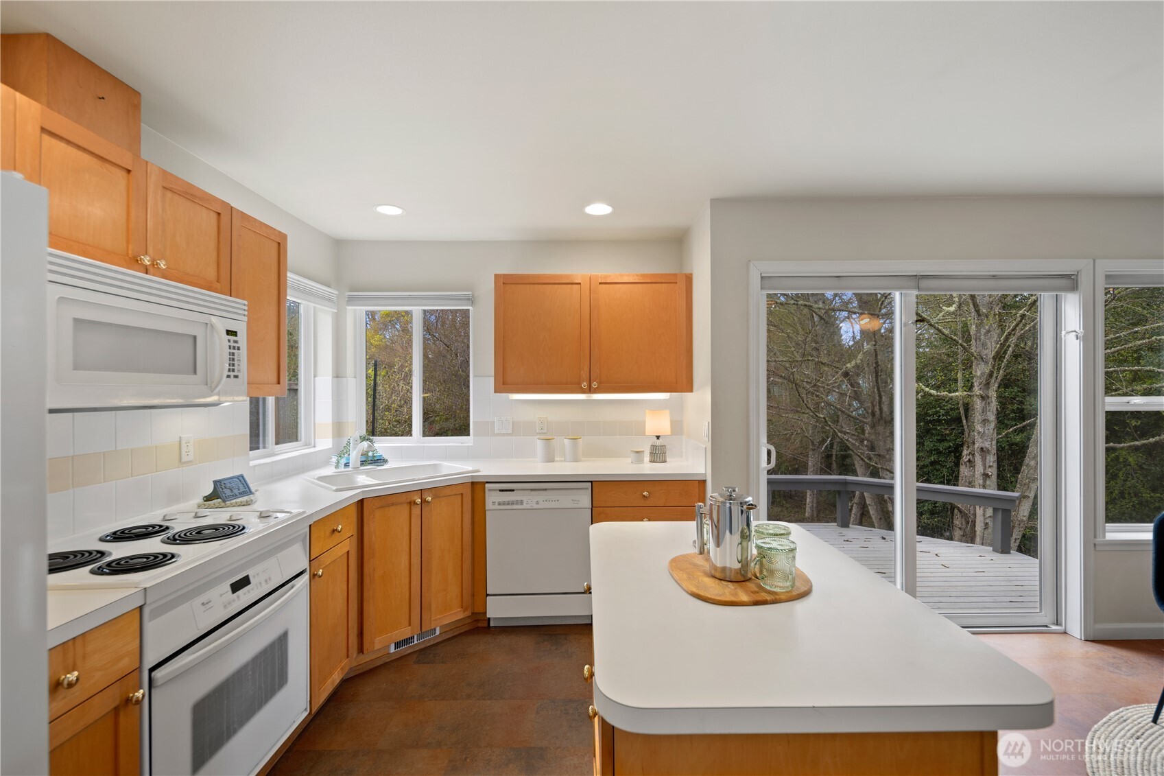 17421 95th Place Southwest Vashon, WA 98070 - Photo 13 of 32 a kitchen with a stove and a sink