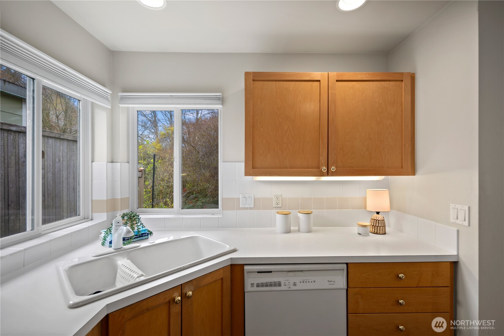 17421 95th Place Southwest Vashon, WA 98070 - Photo 14 of 32 a bathroom with a sink a mirror and a window
