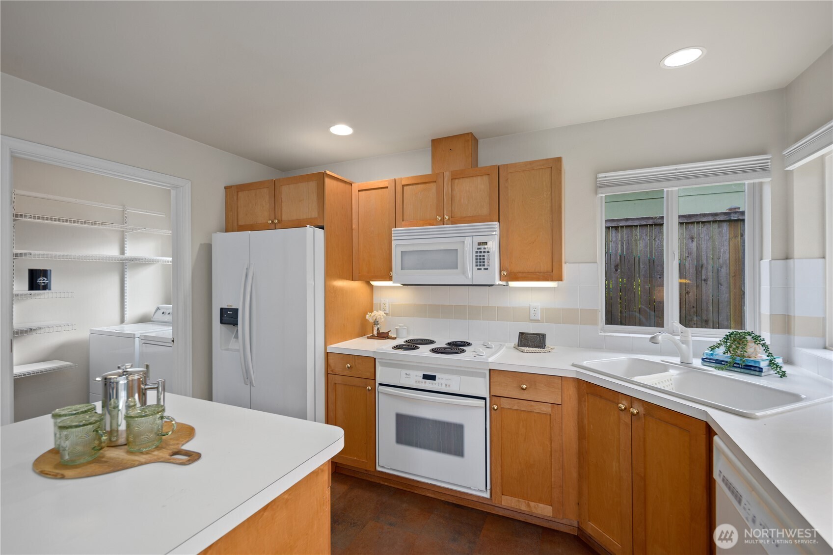 17421 95th Place Southwest Vashon, WA 98070 - Photo 15 of 32 a kitchen with a sink a stove and refrigerator