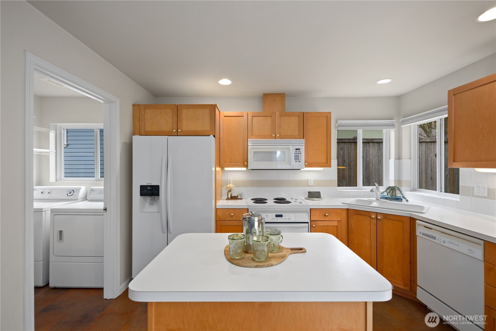 17421 95th Place Southwest Vashon, WA 98070 - Photo 16 of 32 a kitchen with stainless steel appliances granite countertop a sink a refrigerator and a stove