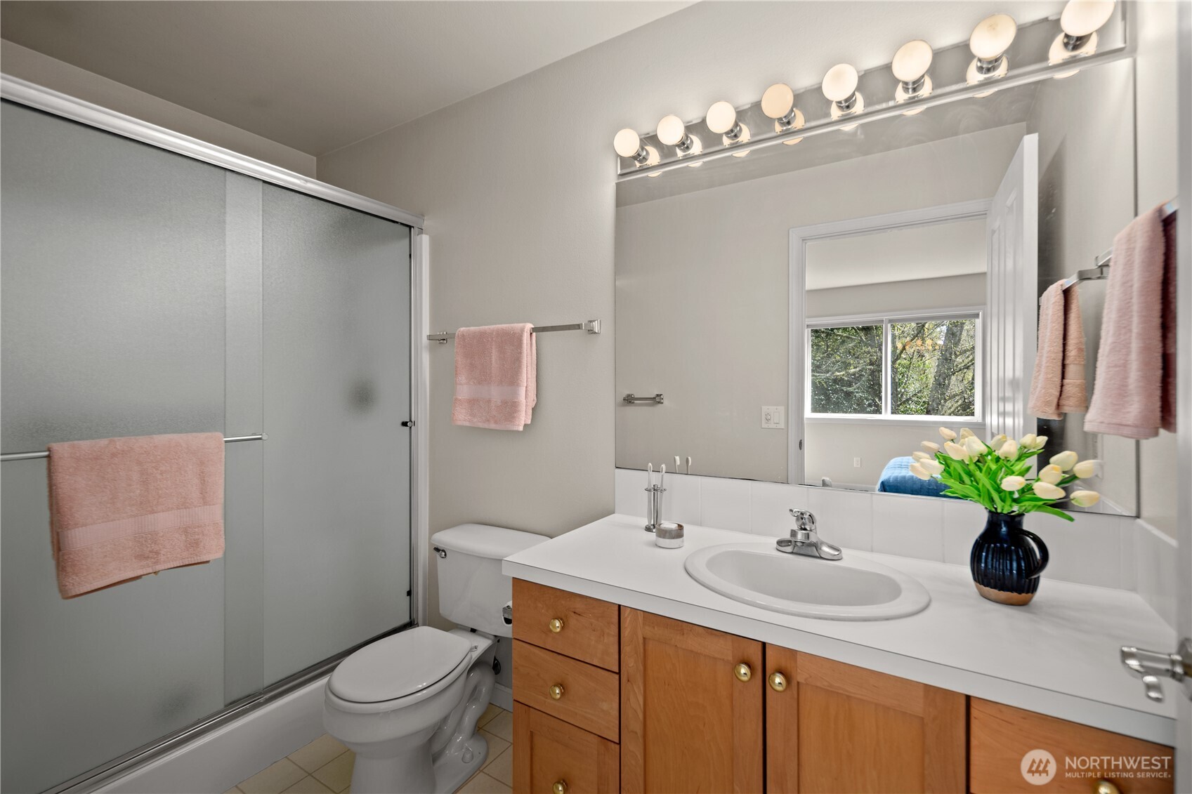 17421 95th Place Southwest Vashon, WA 98070 - Photo 19 of 32 a bathroom with a sink toilet and a mirror