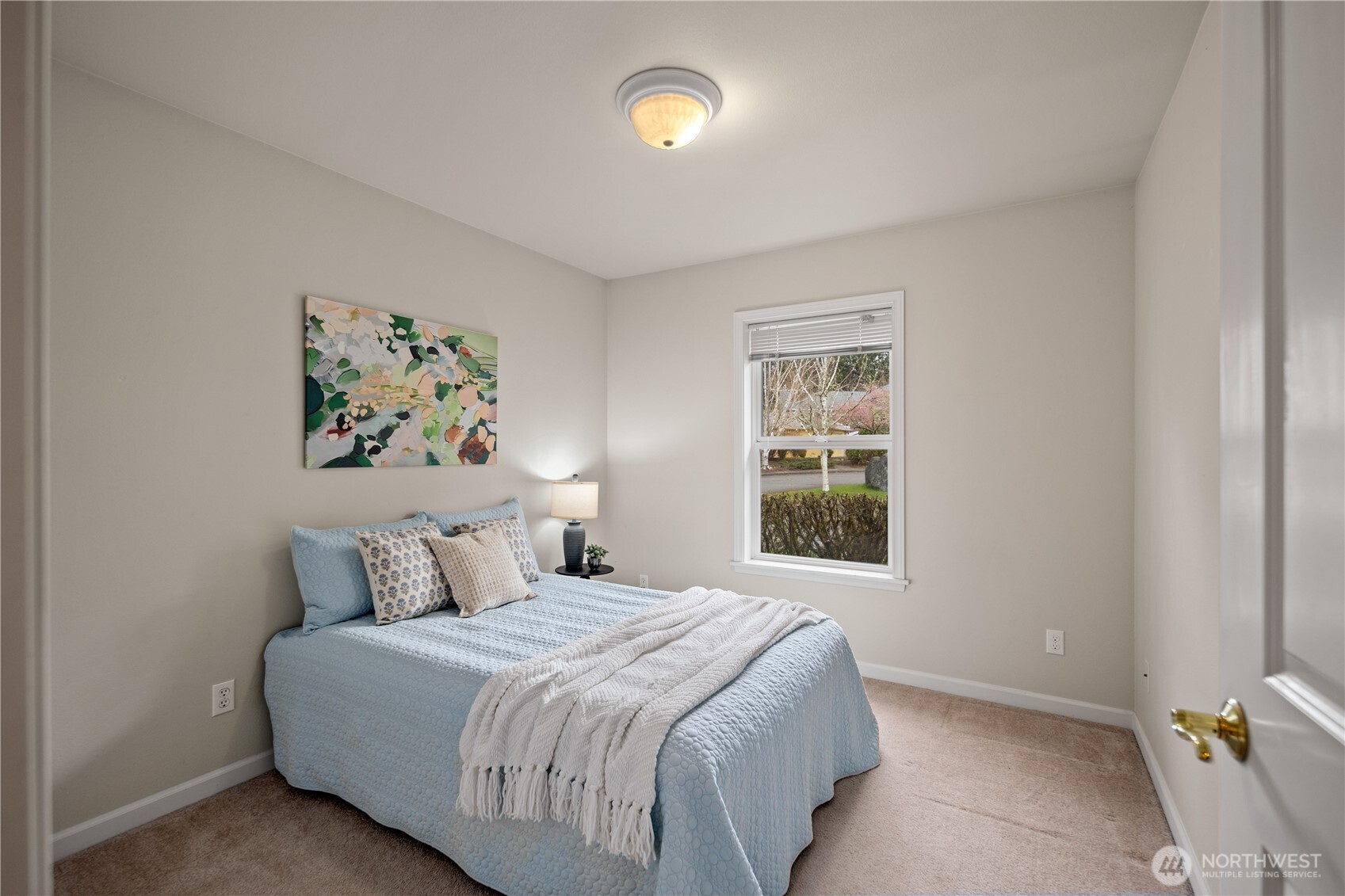 17421 95th Place Southwest Vashon, WA 98070 - Photo 20 of 32 a bedroom with a bed and a window