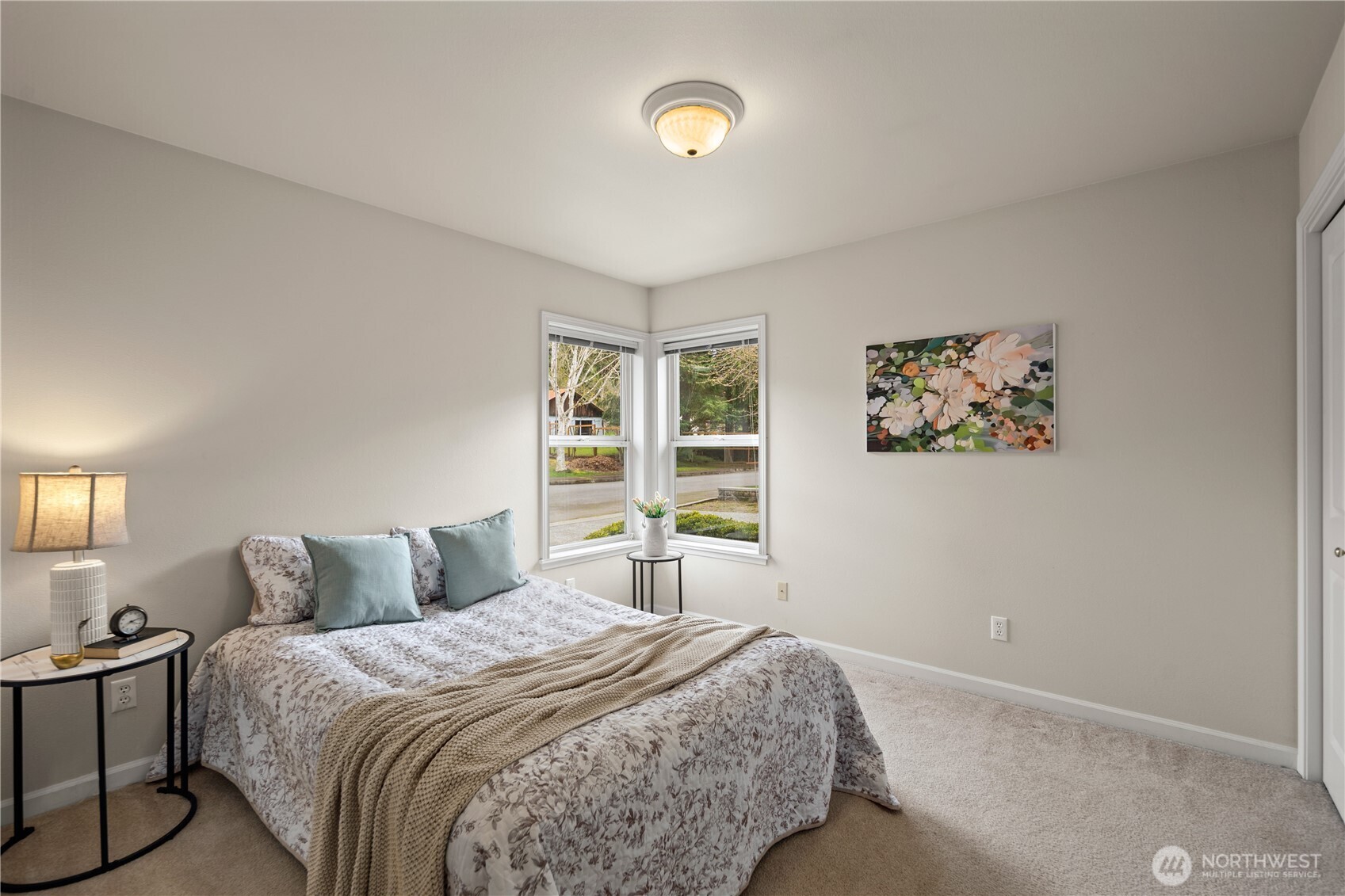 17421 95th Place Southwest Vashon, WA 98070 - Photo 21 of 32 a bedroom with a bed and a window