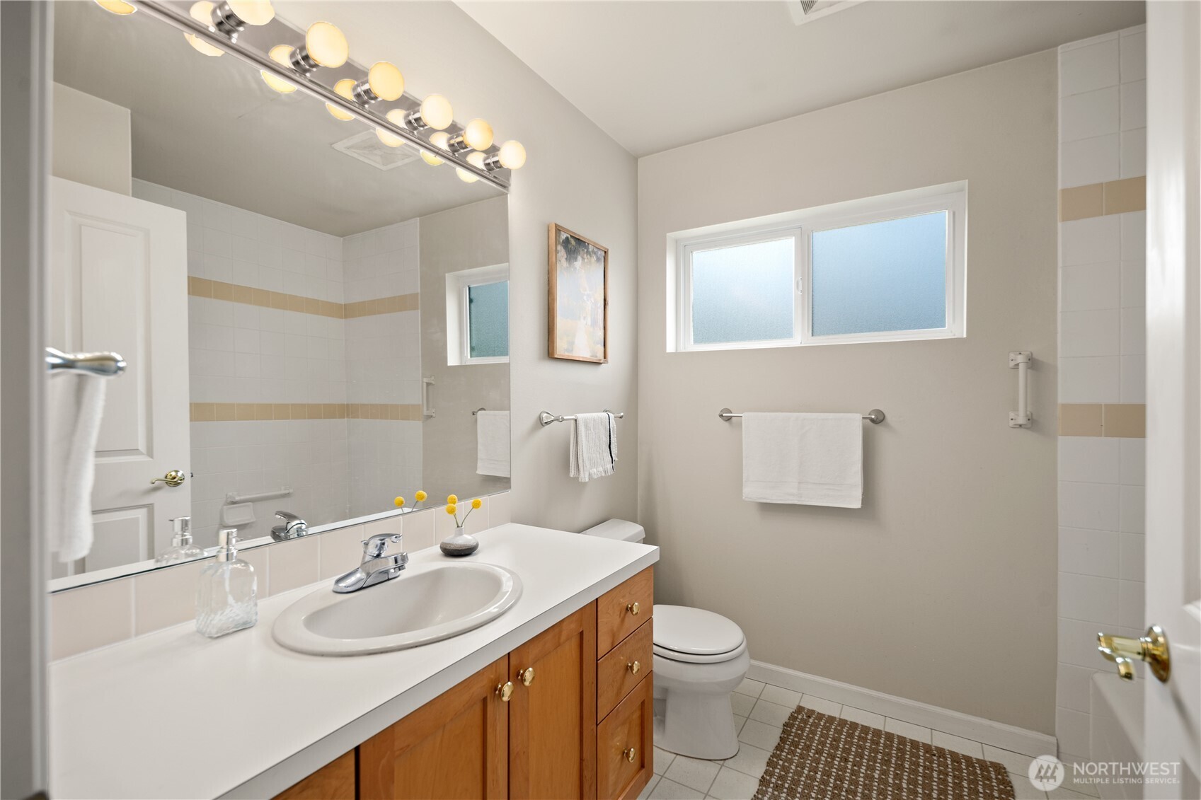 17421 95th Place Southwest Vashon, WA 98070 - Photo 22 of 32 a bathroom with a sink toilet and mirror