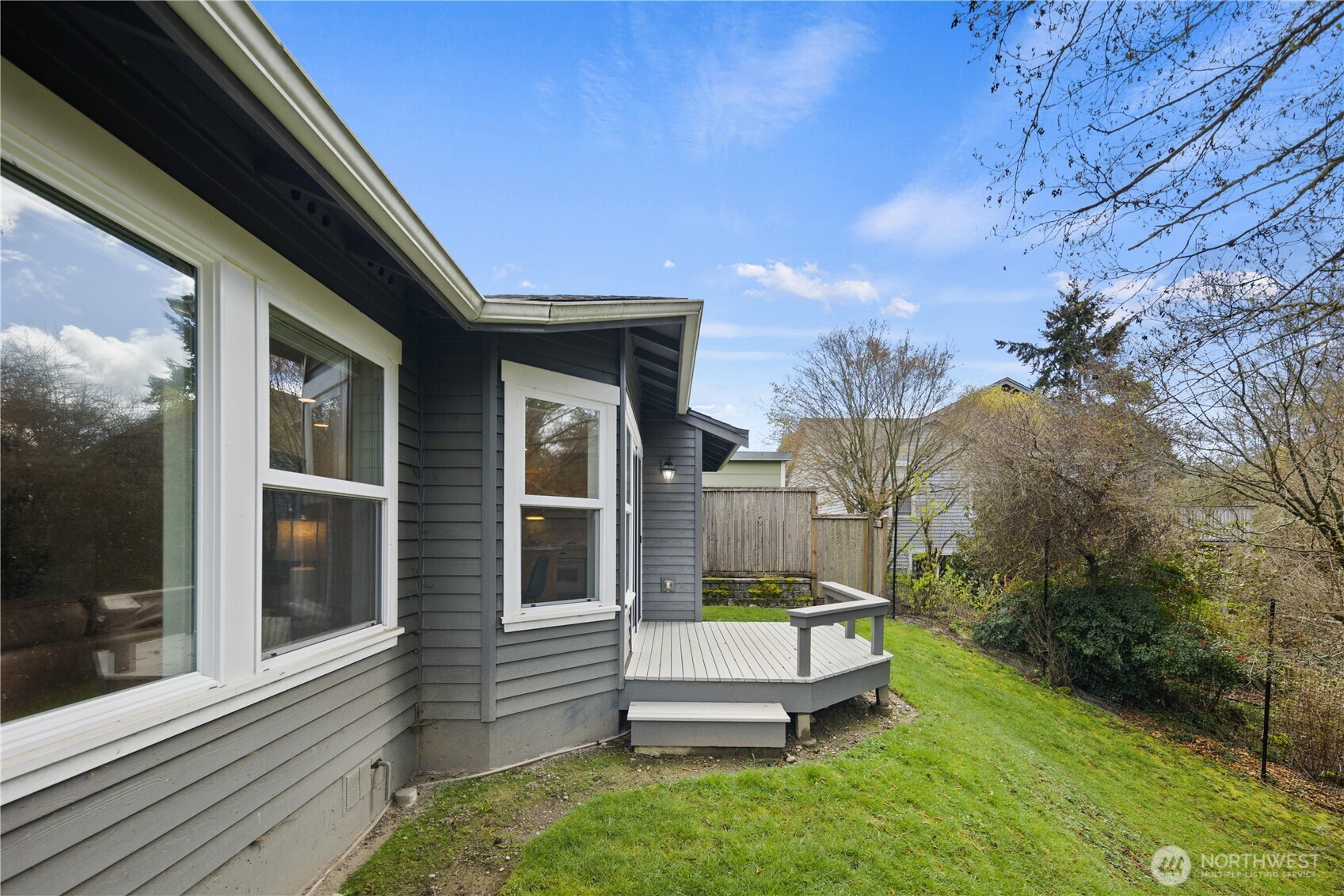 17421 95th Place Southwest Vashon, WA 98070 - Photo 25 of 32 a front view of a house with a yard
