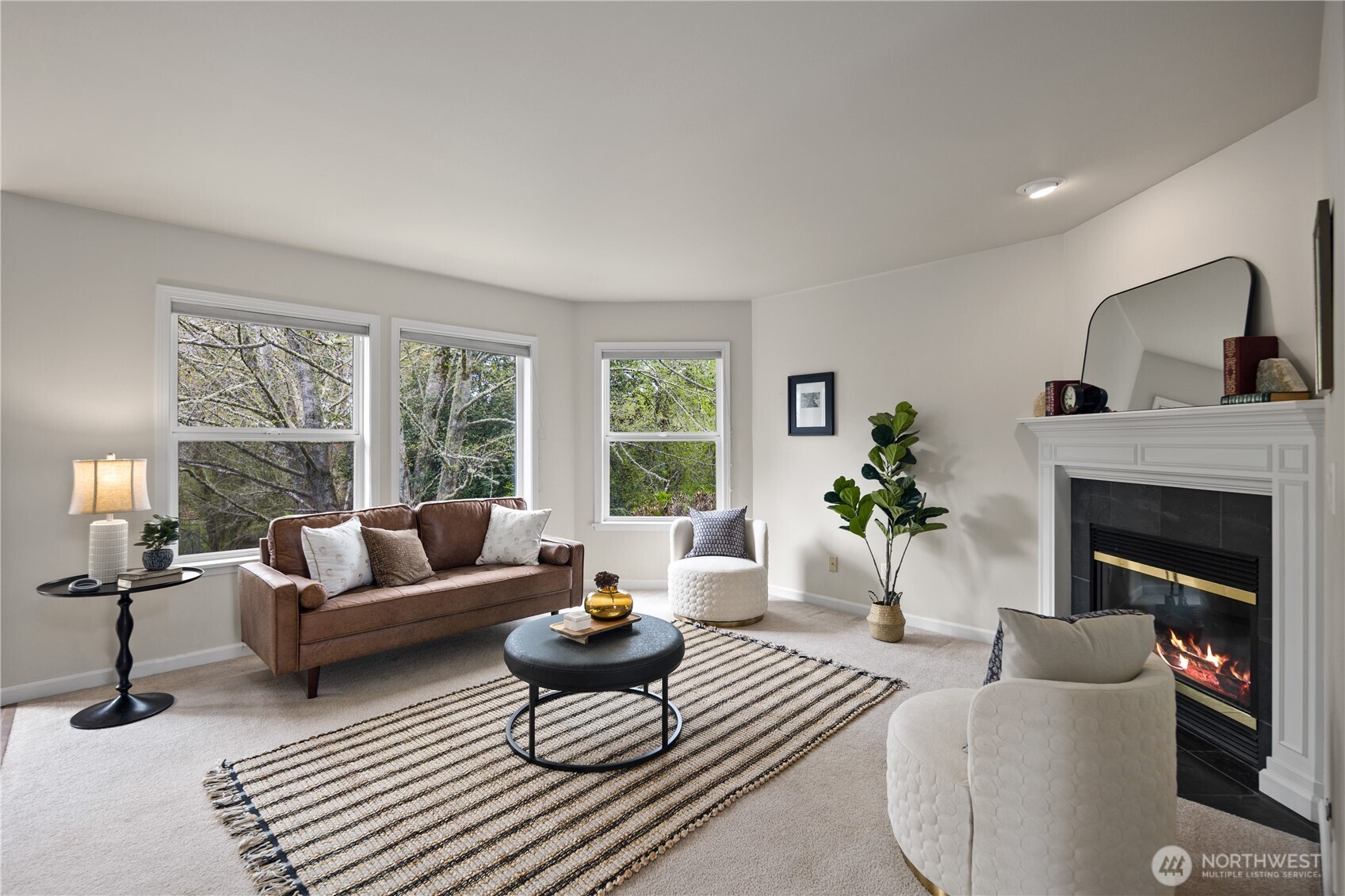 17421 95th Place Southwest Vashon, WA 98070 - Photo 4 of 32 a living room with furniture fireplace and a large window