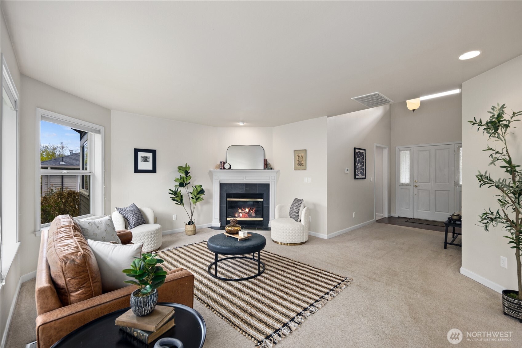 17421 95th Place Southwest Vashon, WA 98070 - Photo 5 of 32 a living room with furniture and a fireplace