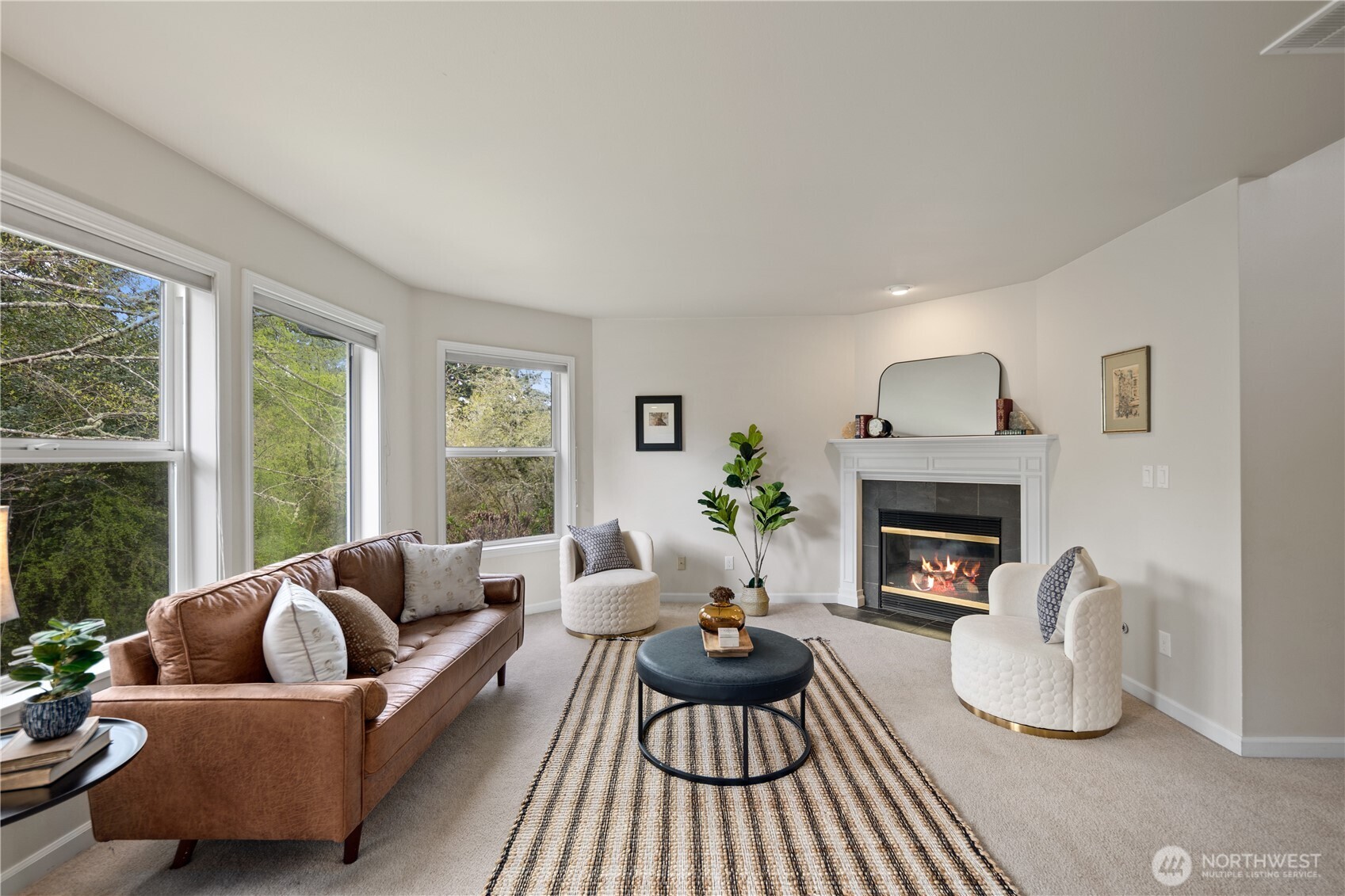 17421 95th Place Southwest Vashon, WA 98070 - Photo 6 of 32 a living room with furniture and a fireplace
