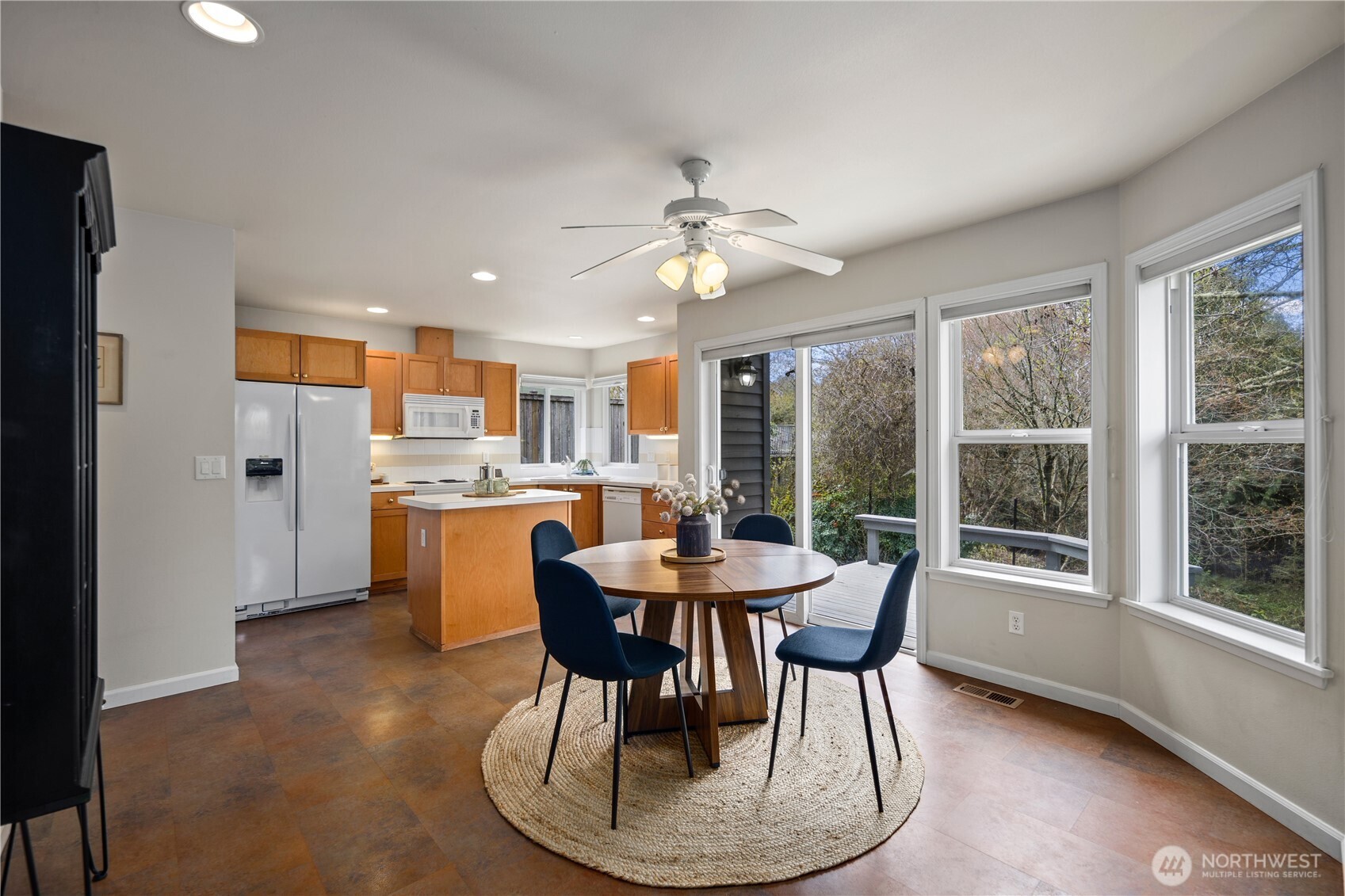 17421 95th Place Southwest Vashon, WA 98070 - Photo 8 of 32 a view of a dining room with furniture a chandelier and wooden floor