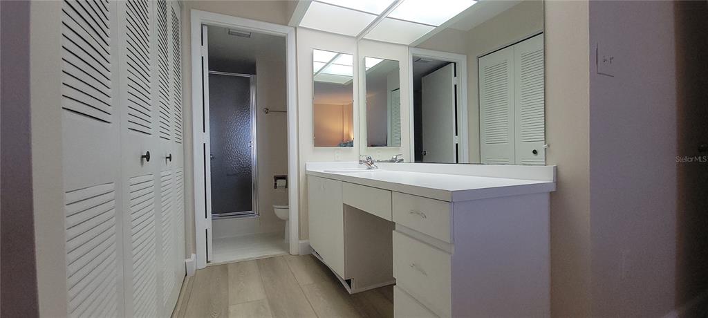 632 Edgewater Drive, Unit 235 Dunedin, FL 34698 - Photo 18 of 37 a bathroom with a sink and a mirror