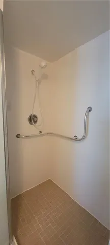 a bathroom with a toilet and a mirror