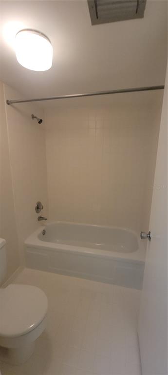 632 Edgewater Drive, Unit 235 Dunedin, FL 34698 - Photo 23 of 37 a bathroom with a shower and a toilet