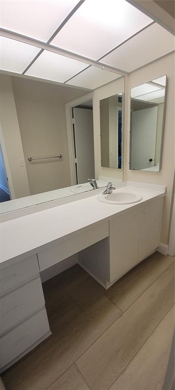 632 Edgewater Drive, Unit 235 Dunedin, FL 34698 - Photo 26 of 37 a bathroom with a sink and a mirror