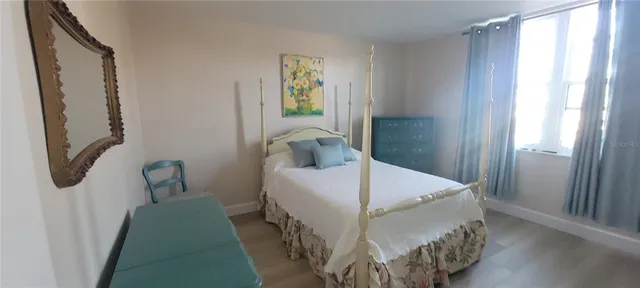 a room with gym equipment pool table and chairs