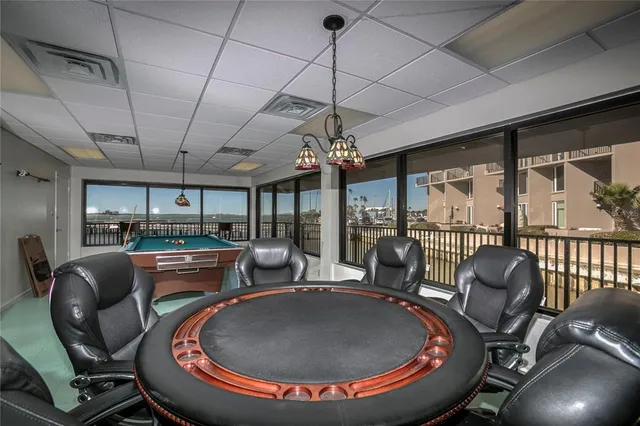 a view of building with yard and swimming pool