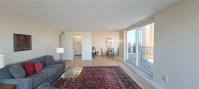 a living room with furniture and a rug