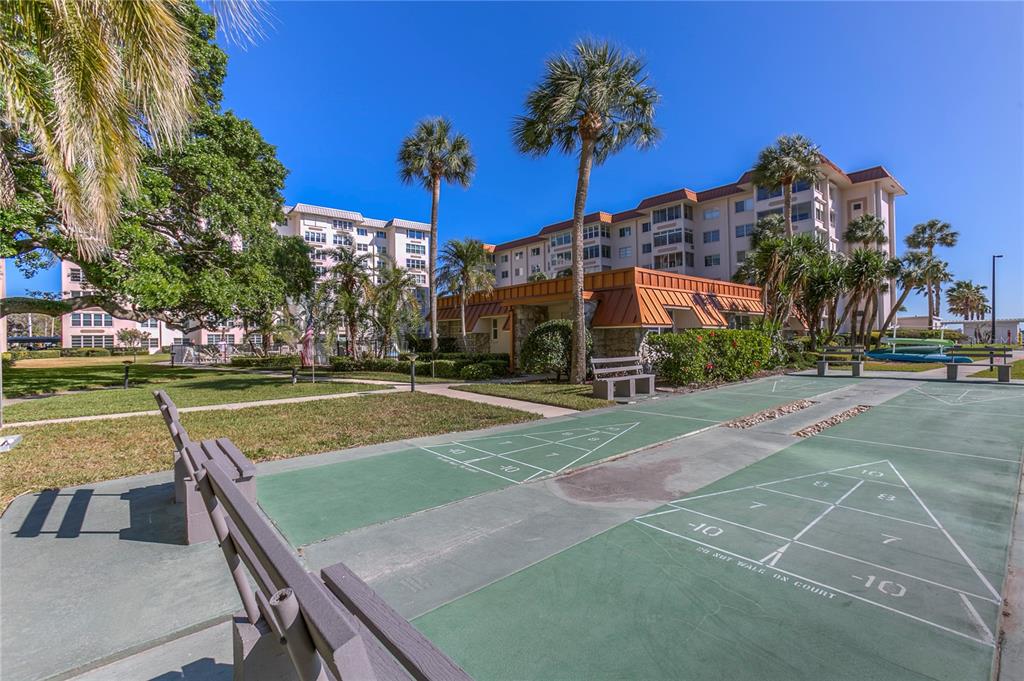 632 Edgewater Drive, Unit 235 Dunedin, FL 34698 - Photo 33 of 37 a view of a house with a swimming pool