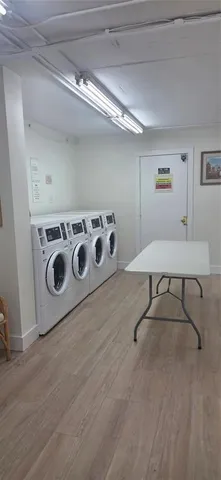 a stove top oven sitting inside of a kitchen