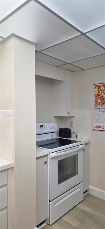 632 Edgewater Drive, Unit 235 Dunedin, FL 34698 - Photo 37 of 37 a stove top oven sitting inside of a kitchen